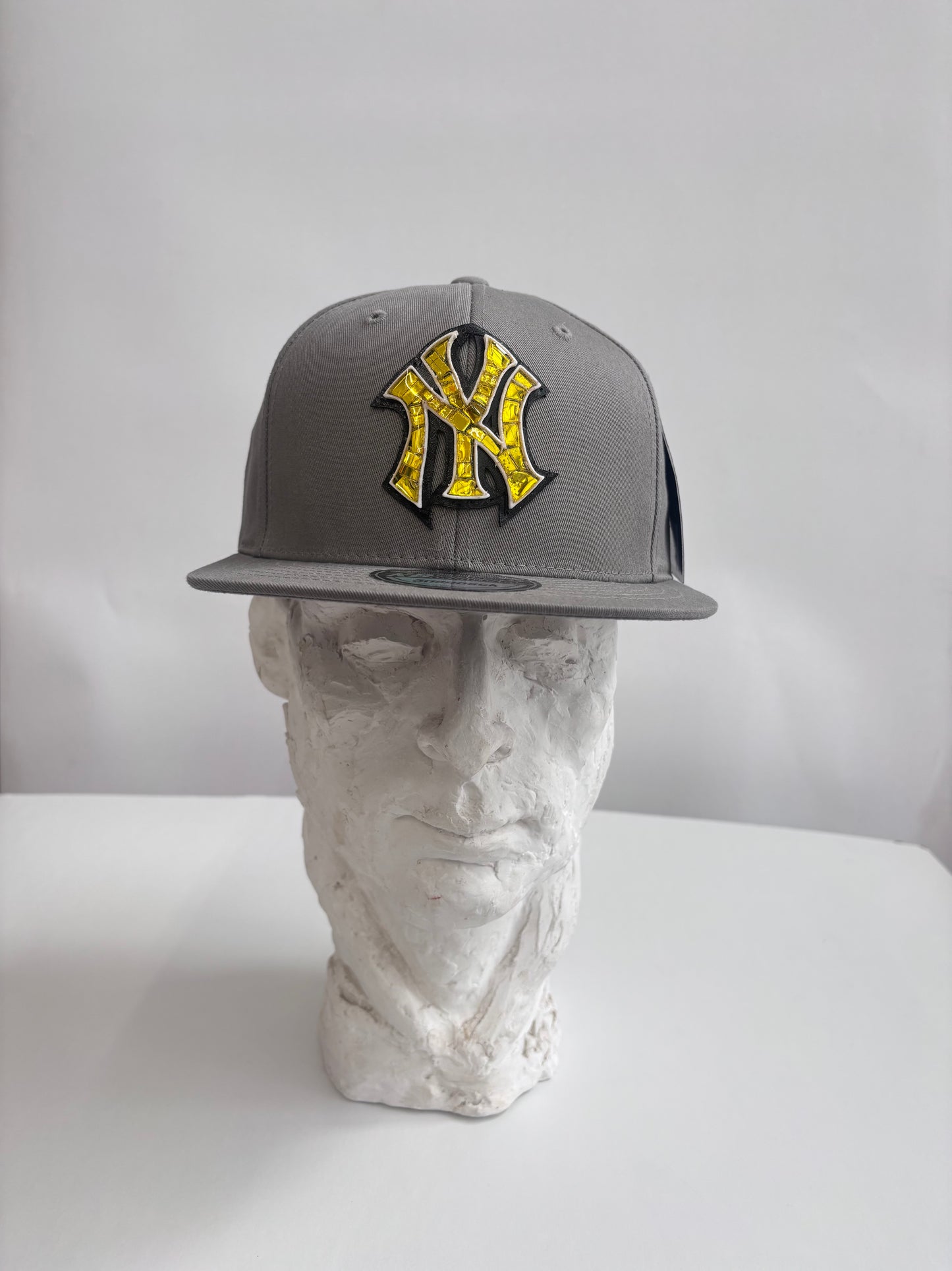 six panel gray baseball cap with gold Yankees micro mosaic logo