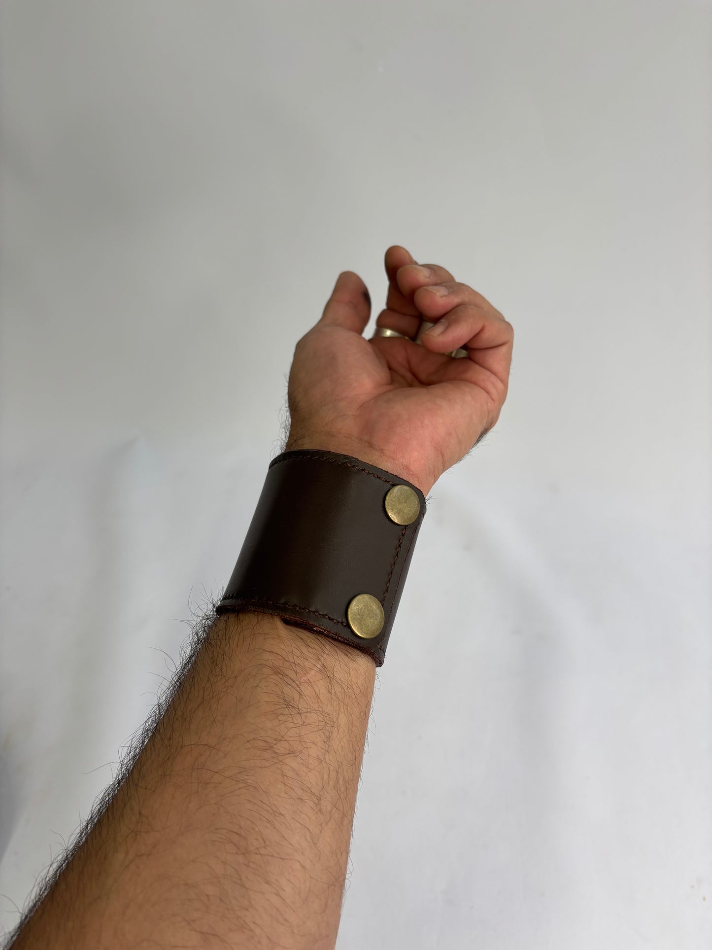 Brown and green leather cuff with gold
