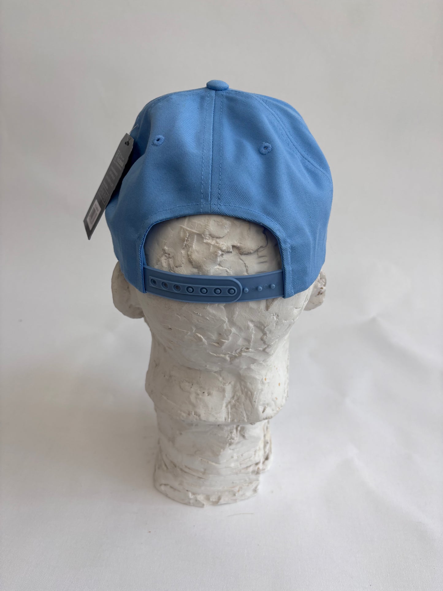six panel light blue baseball cap with lilac micro mosaic logo