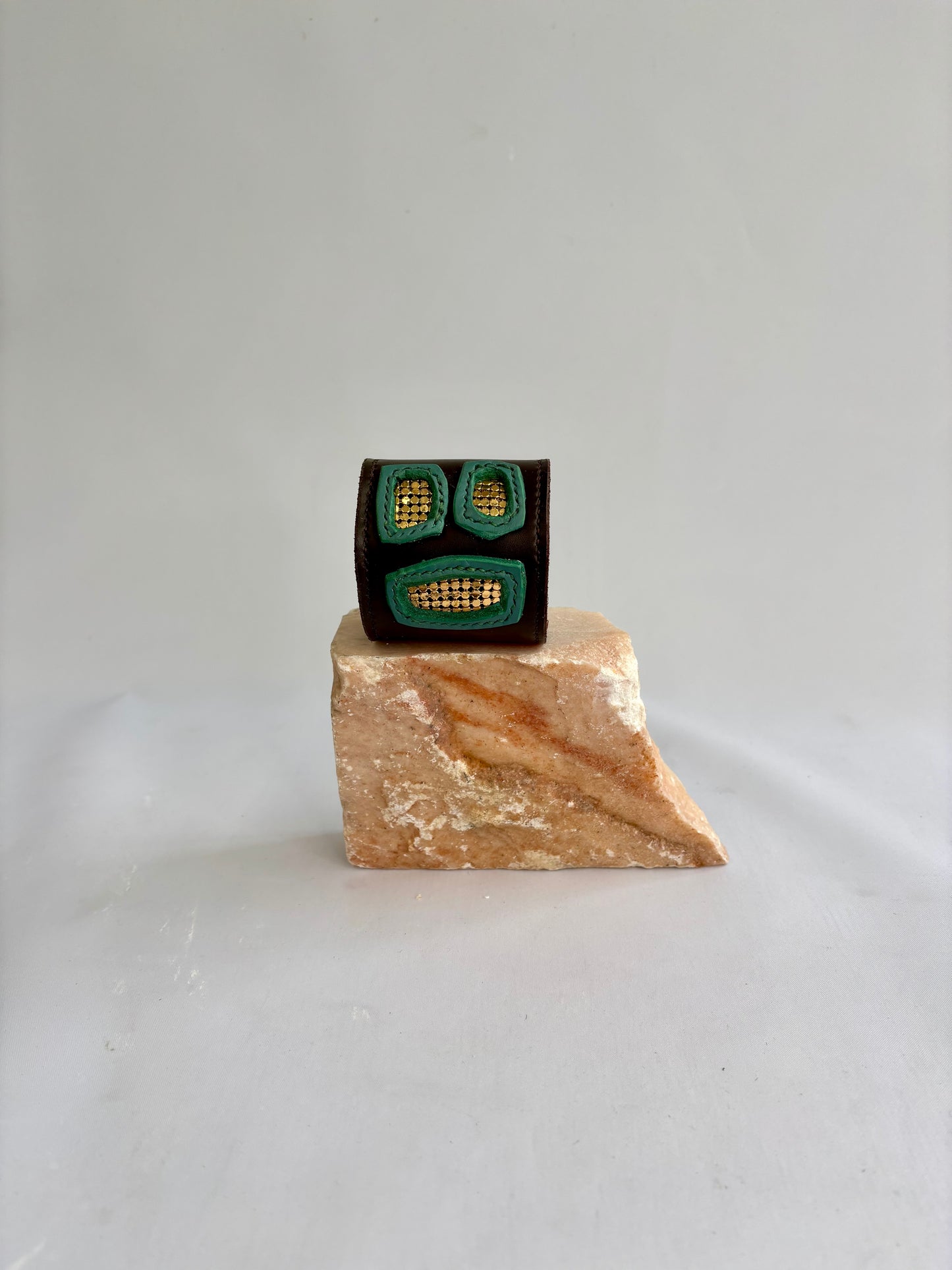 Brown and green leather cuff with gold