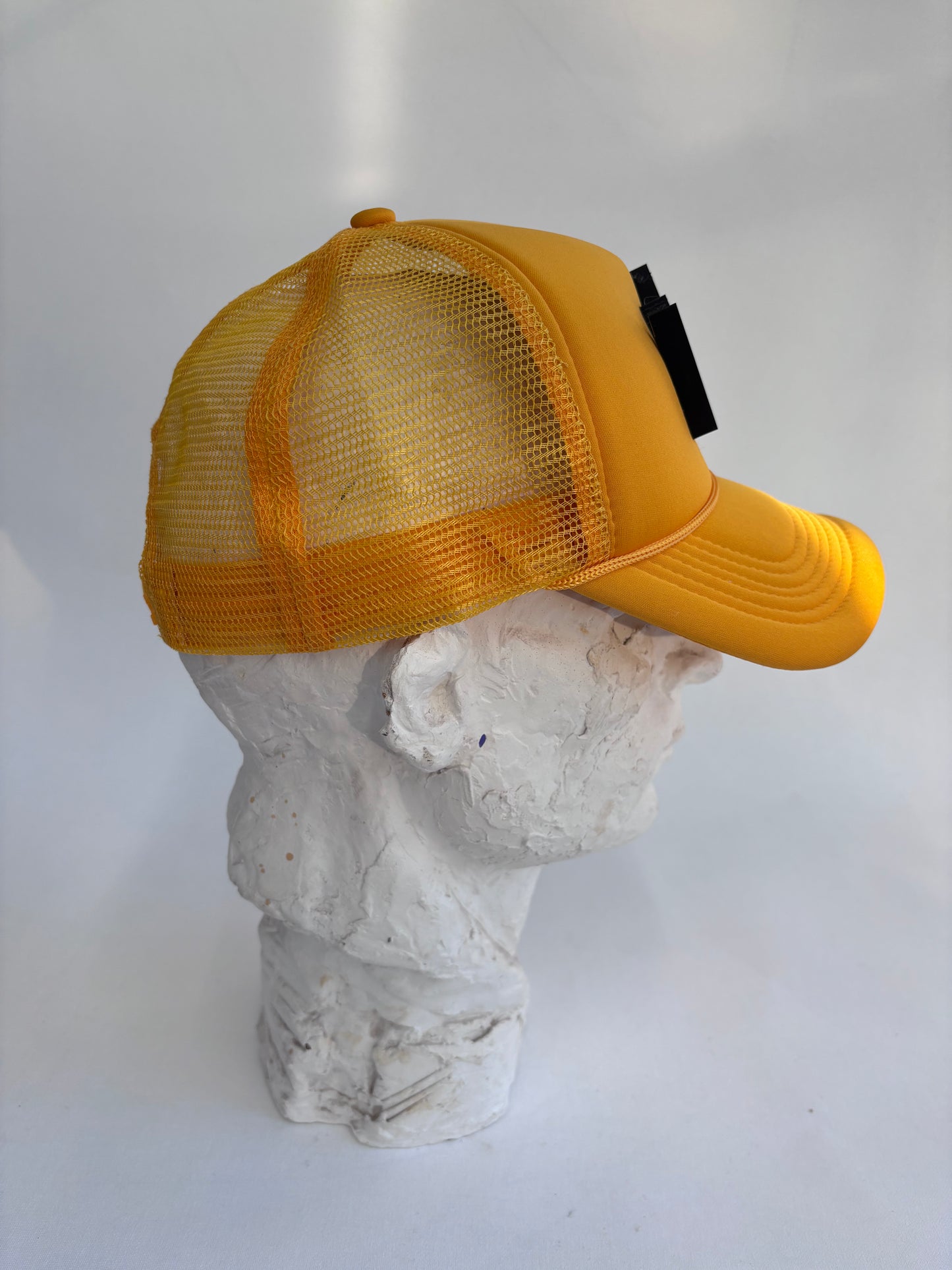 Adjustable black 6 panel yellow trucker hat with gold glass Mosaic Basquiat crown