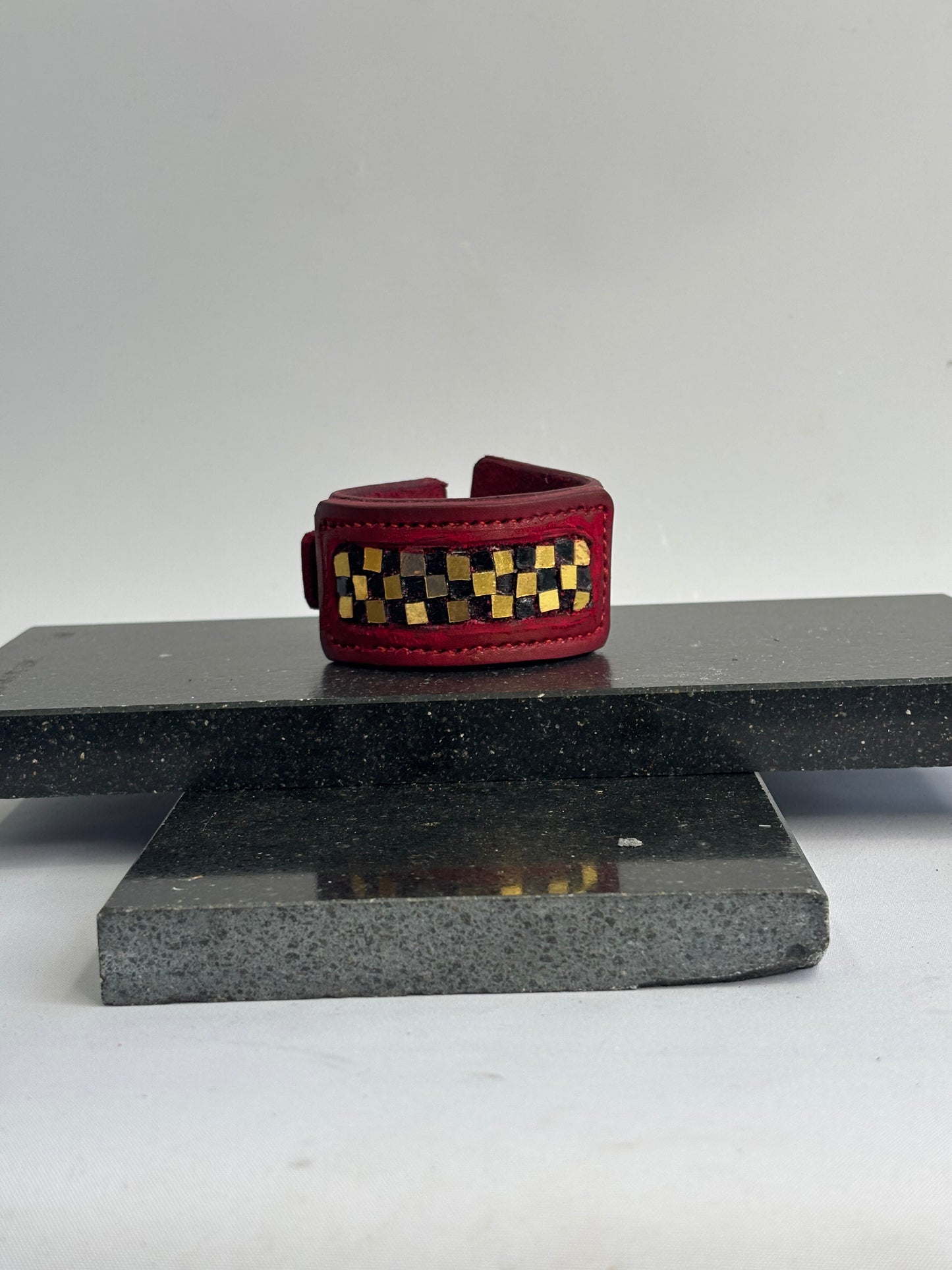 Red leather gold and black glass inlaid leather Cuff