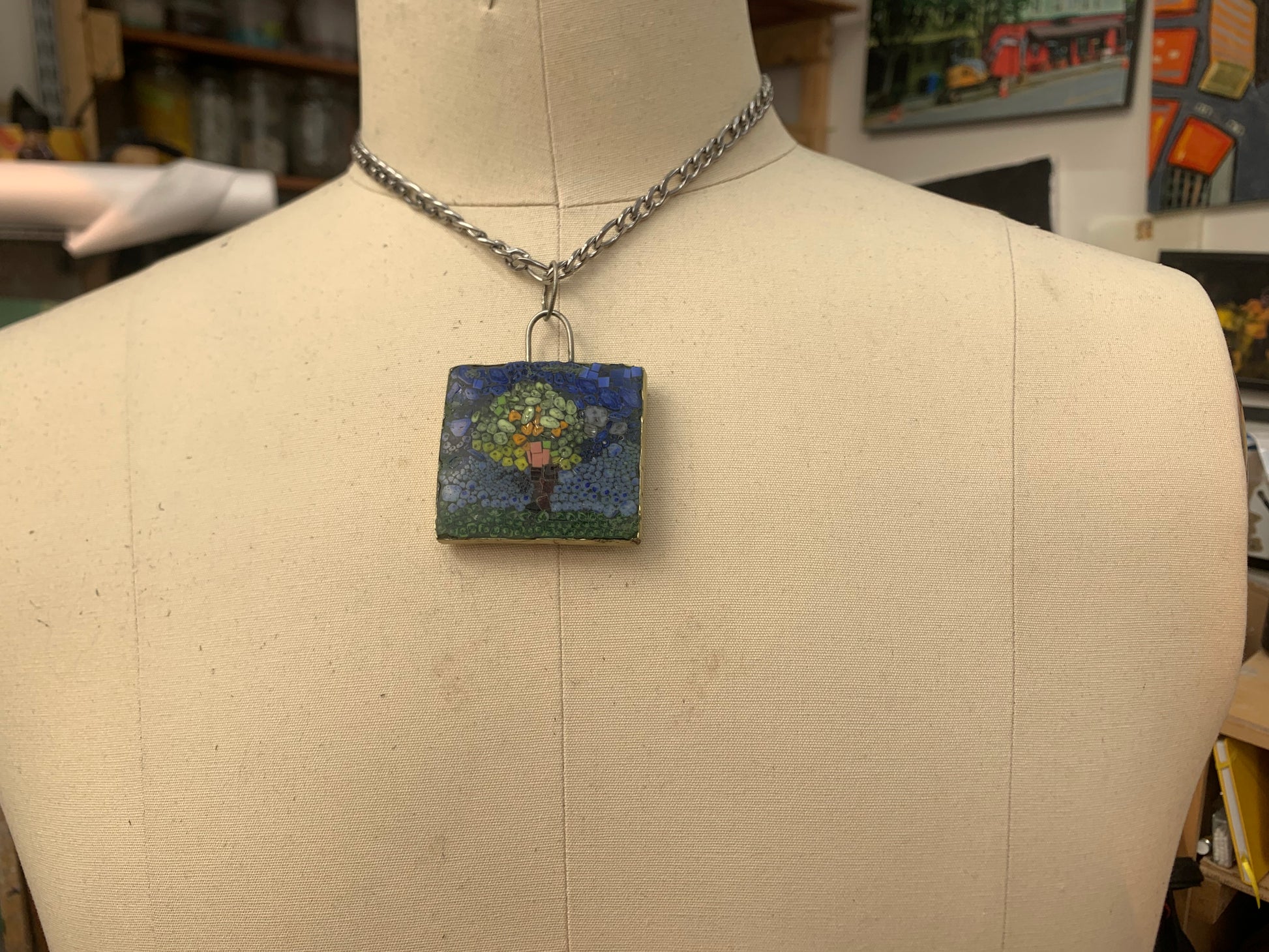 image of the tree of life micro mosaic with a stainless steel chain on a male chest form