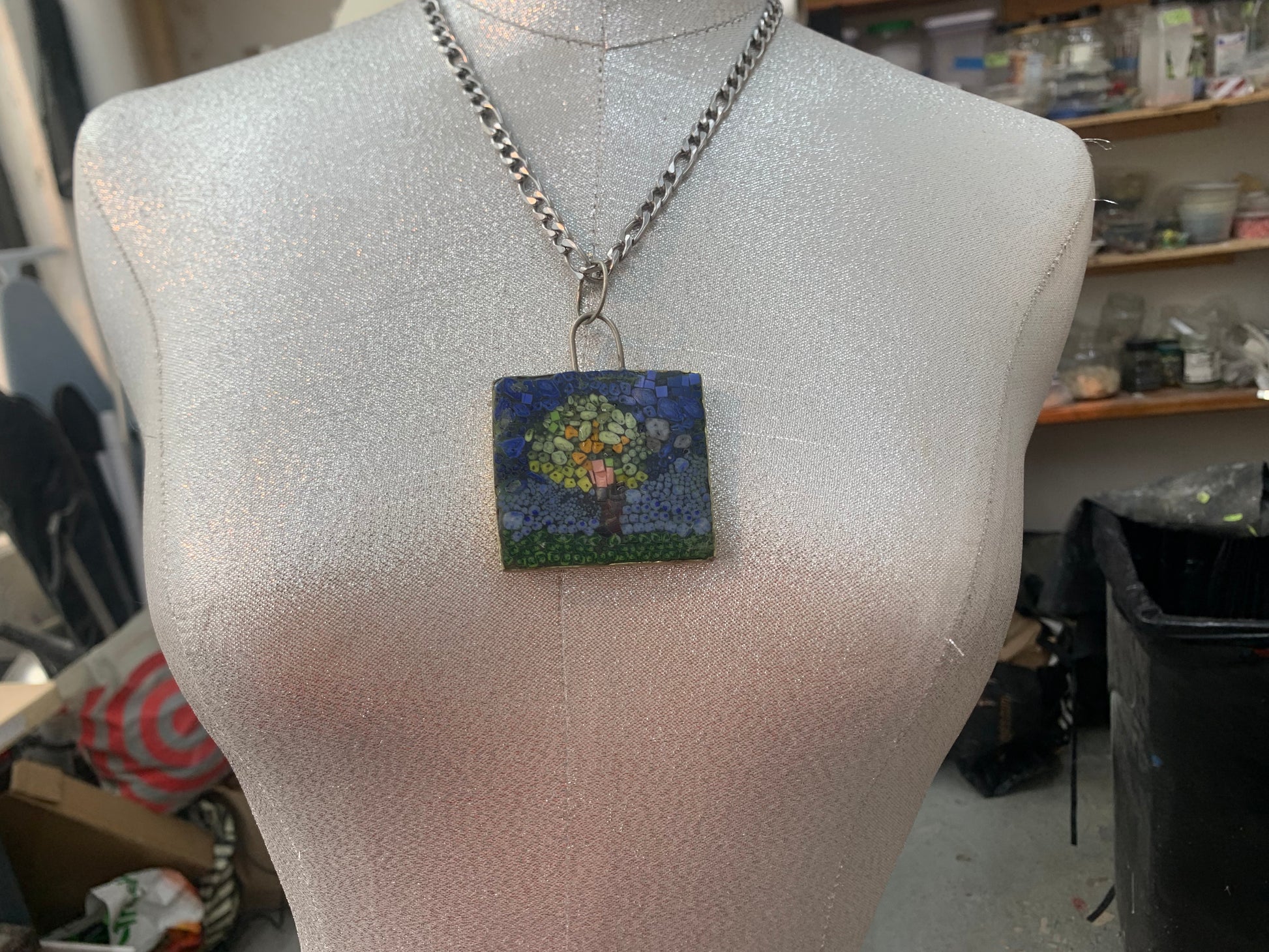 image of the tree of life micro mosaic with a stainless steel chain on a female form