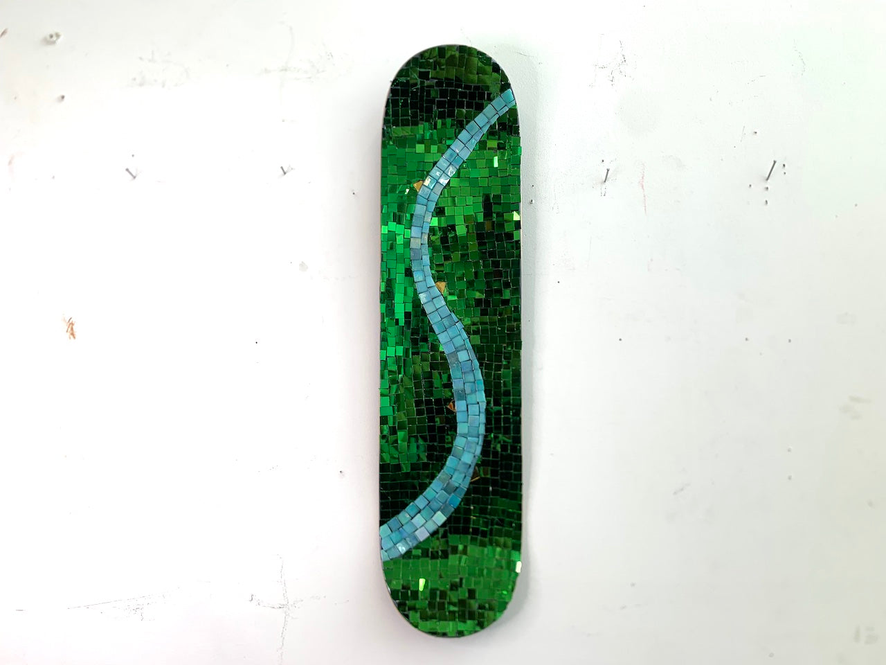 Green Thai mirror glass skateboard deck depicting spring Edit alt text