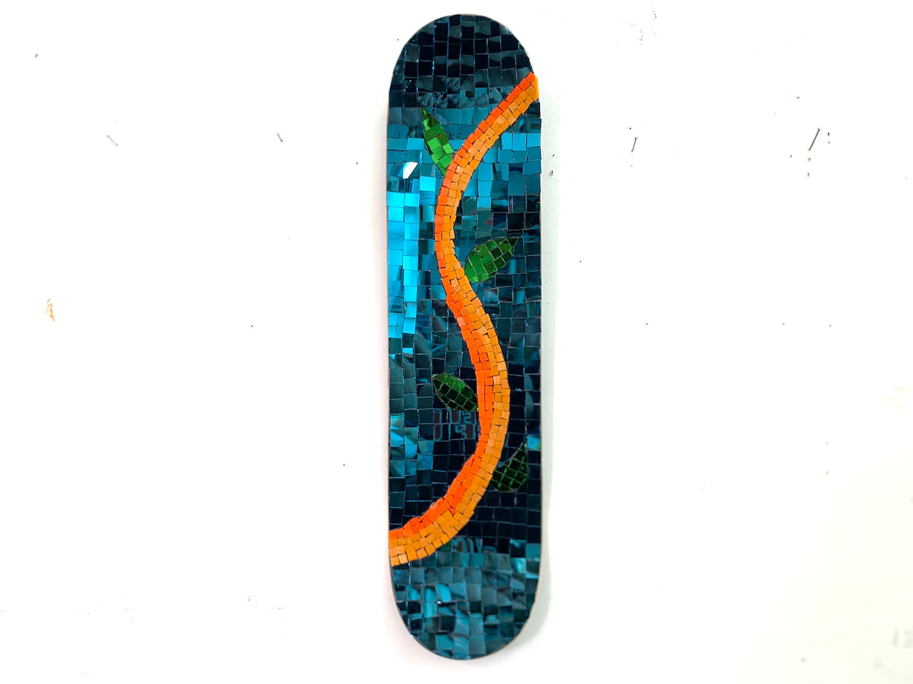 Thai mirror glass  skateboard depicting spring  with teal background Edit alt text