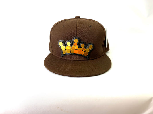 brown baseball hat with a 18 karat gold crown