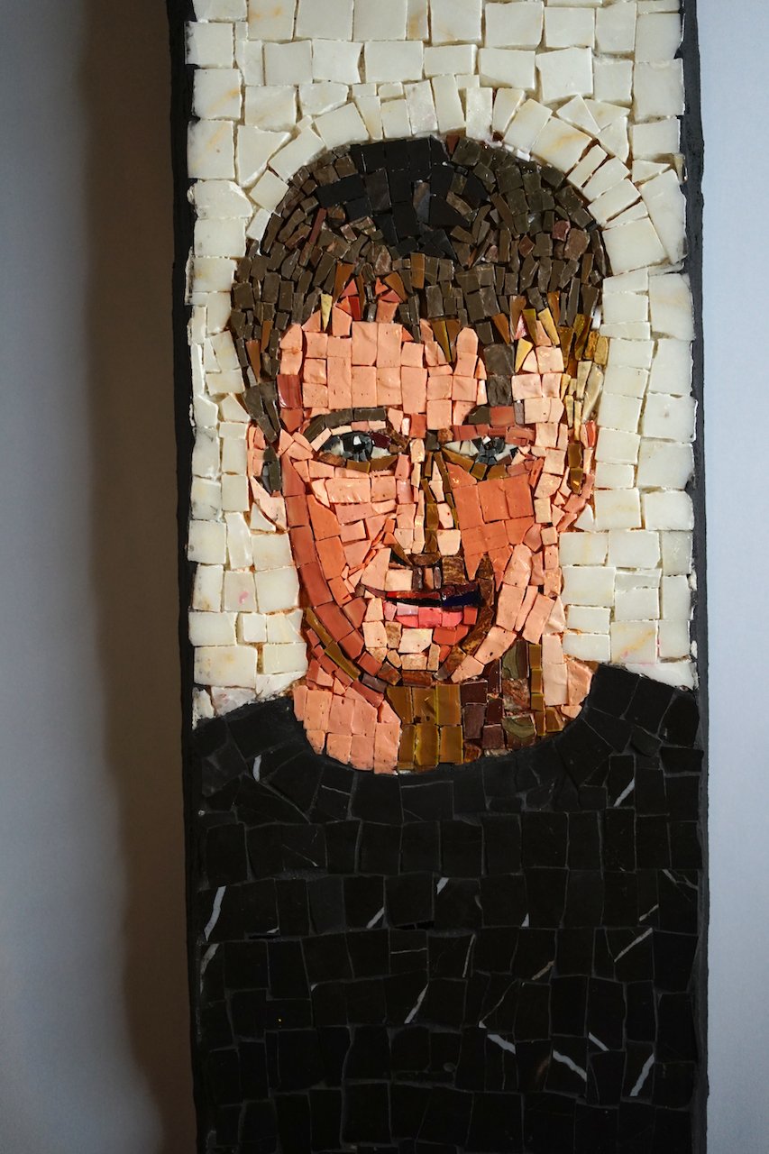 close up image of a skateboard mosaic of adult Tony Hawk
