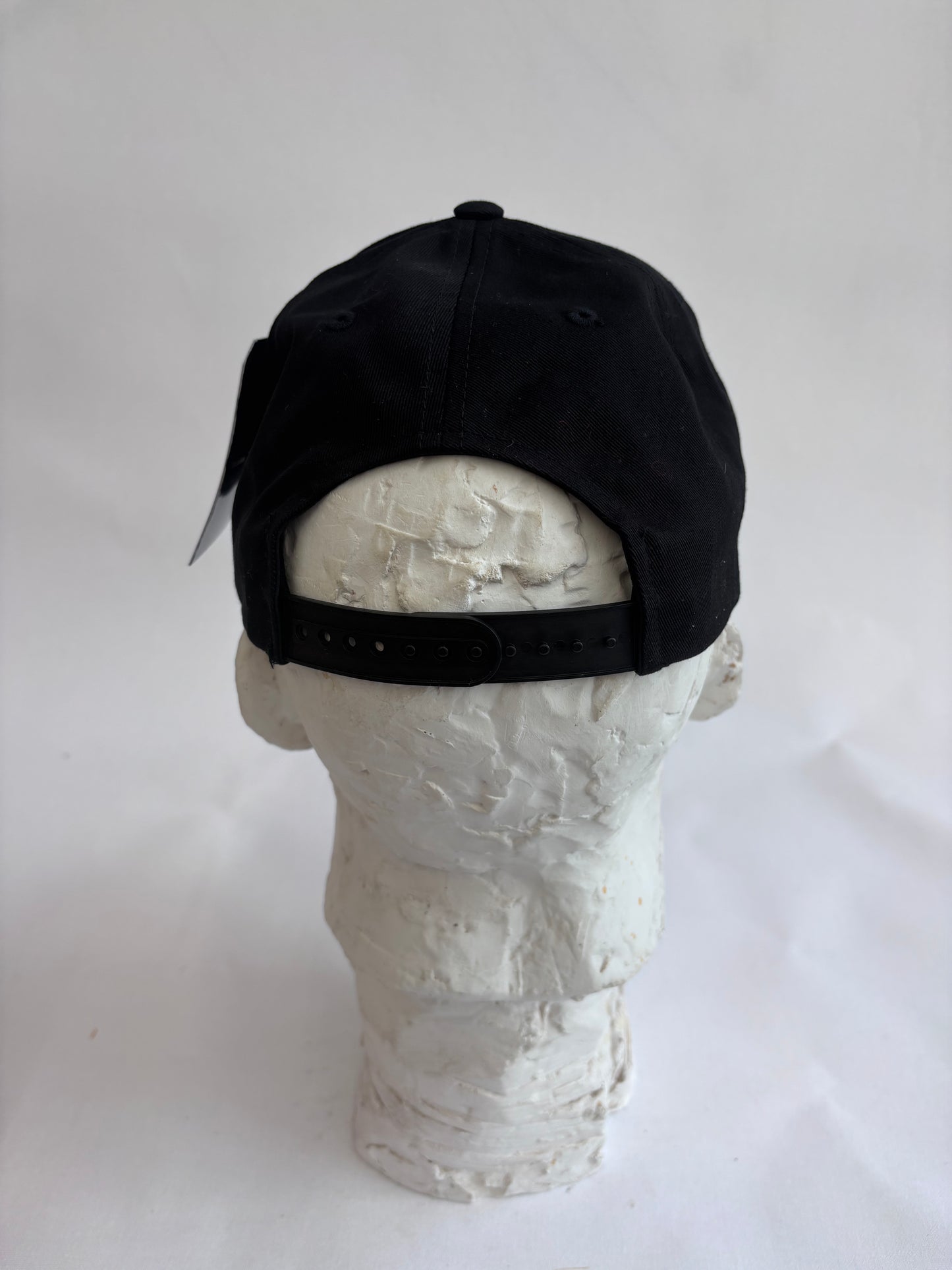 Adjustable black 6 panel baseball cap with gray Orange Mosaic Basquiat crown