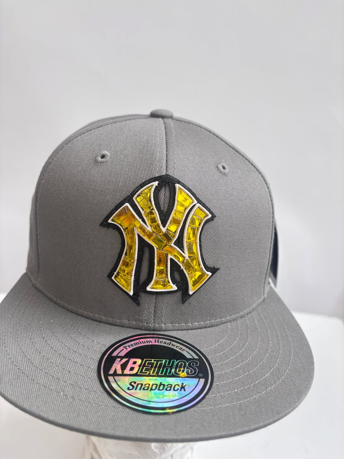 six panel gray baseball cap with gold Yankees micro mosaic logo