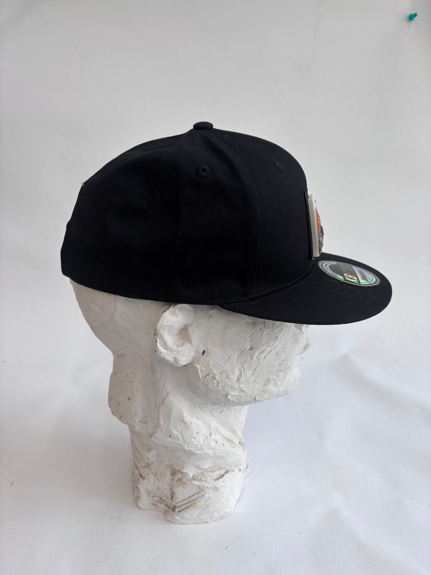 Adjustable black 6 panel baseball cap with gray Orange Mosaic Basquiat crown