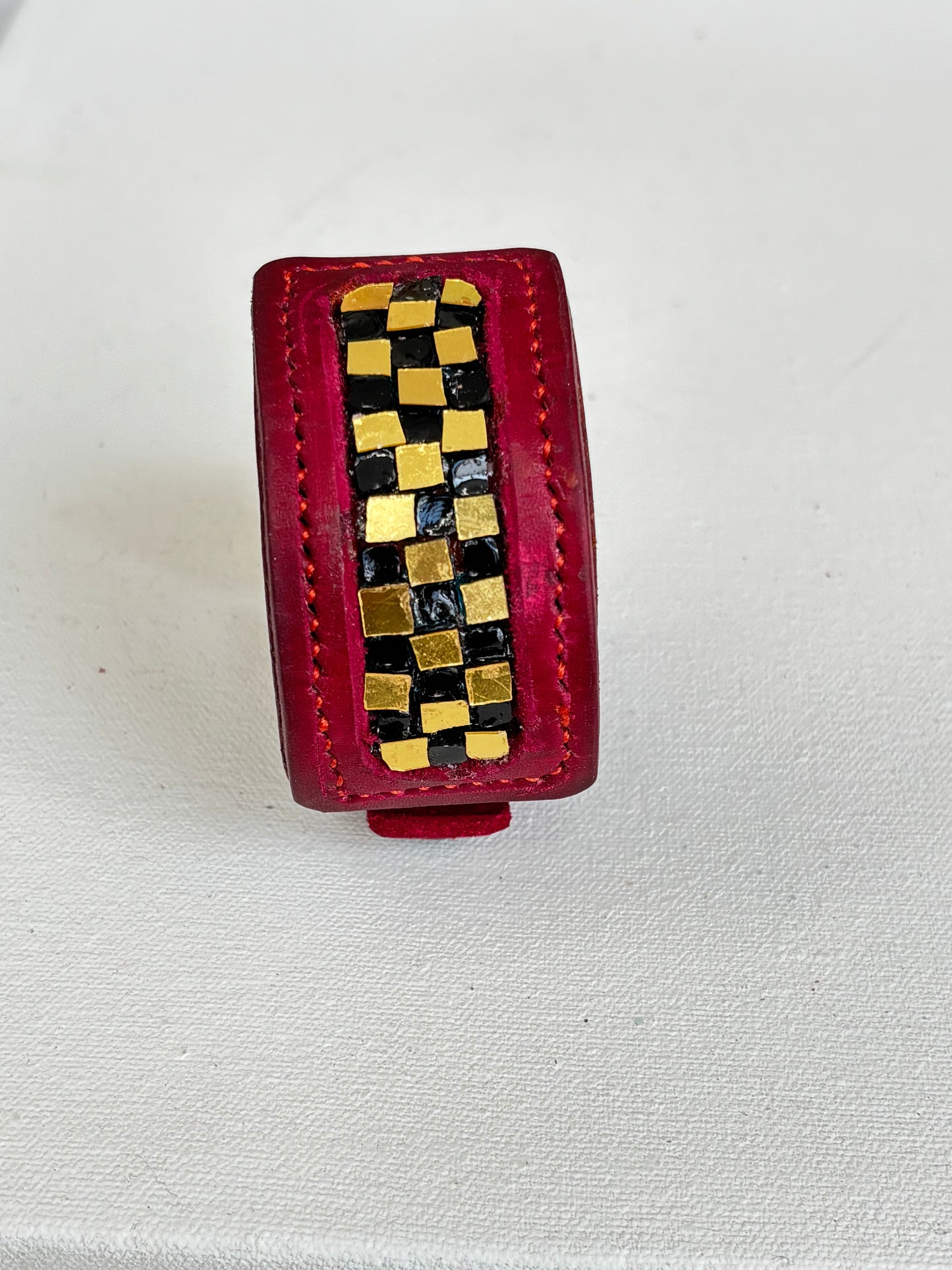 Red leather gold and black glass inlaid leather Cuff
