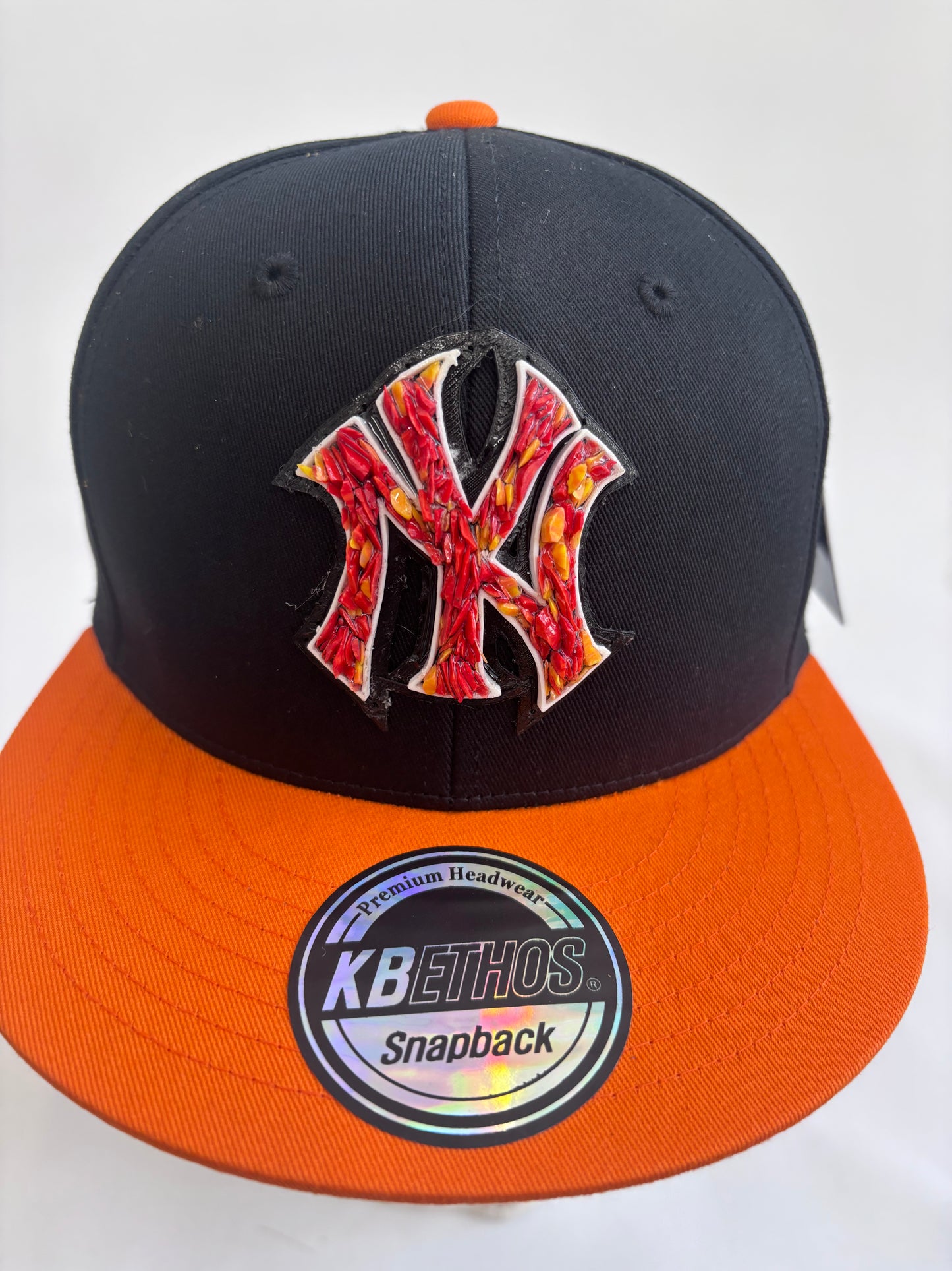 six panel Blue and Black  and Orange  baseball hat with orange glass Yankees  micro mosaic logo