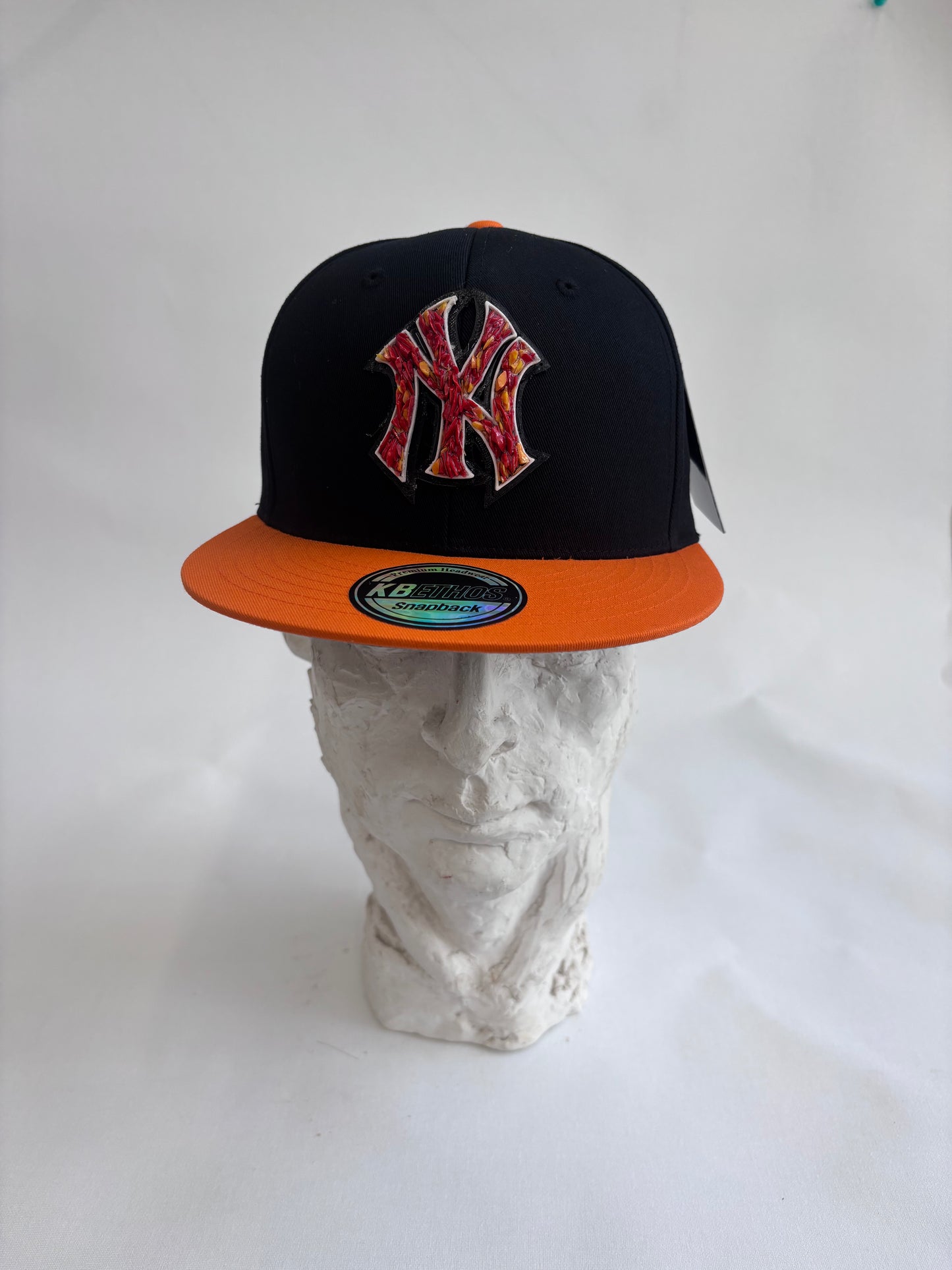 six panel Blue and Black  and Orange  baseball hat with orange glass Yankees  micro mosaic logo