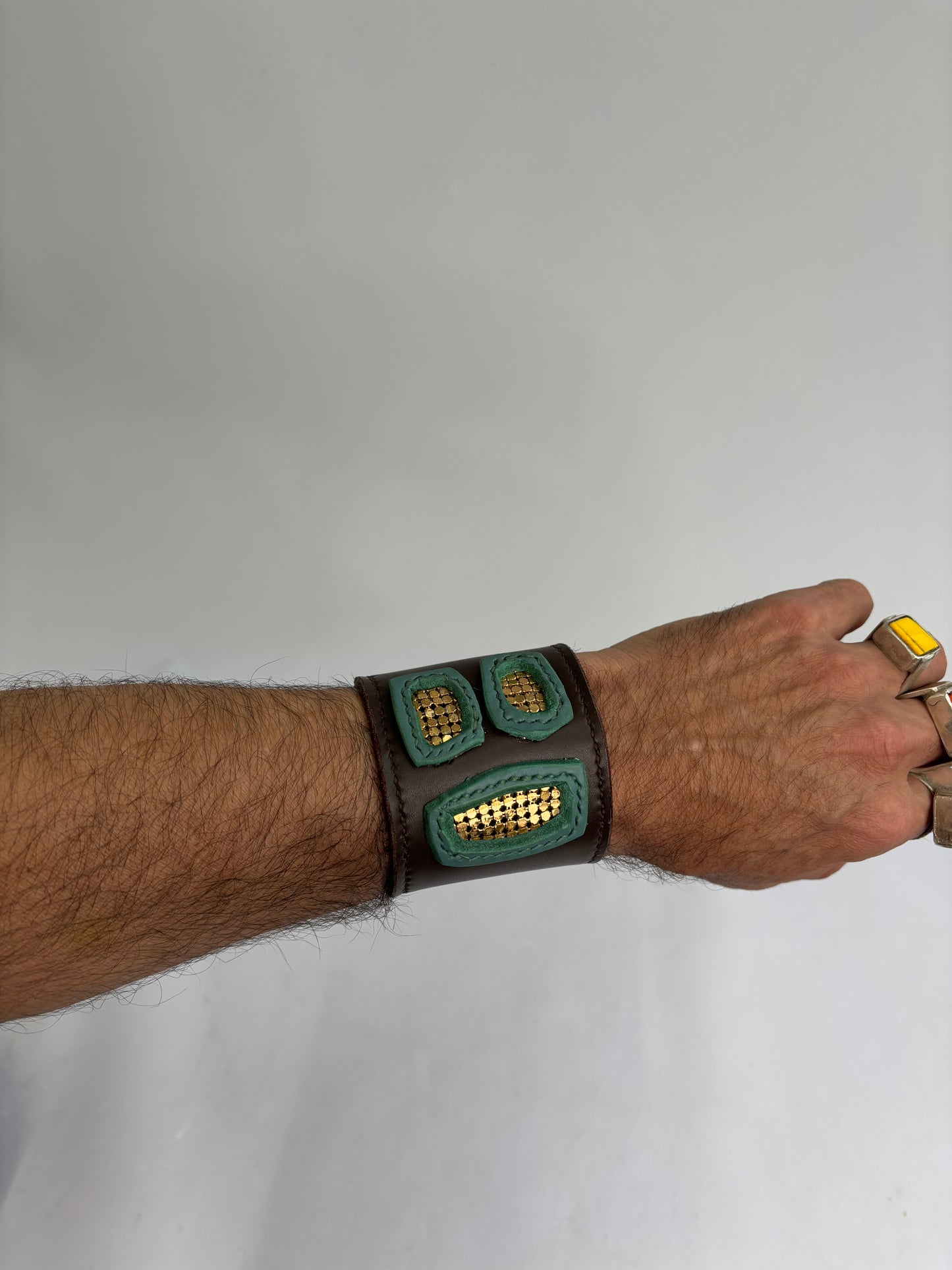 Brown and green leather cuff with gold