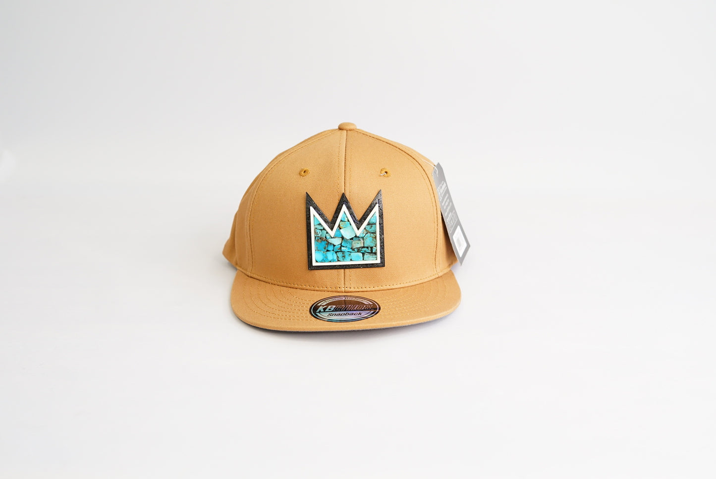 light brown baseball cap with Turquoise Crown Mosaic