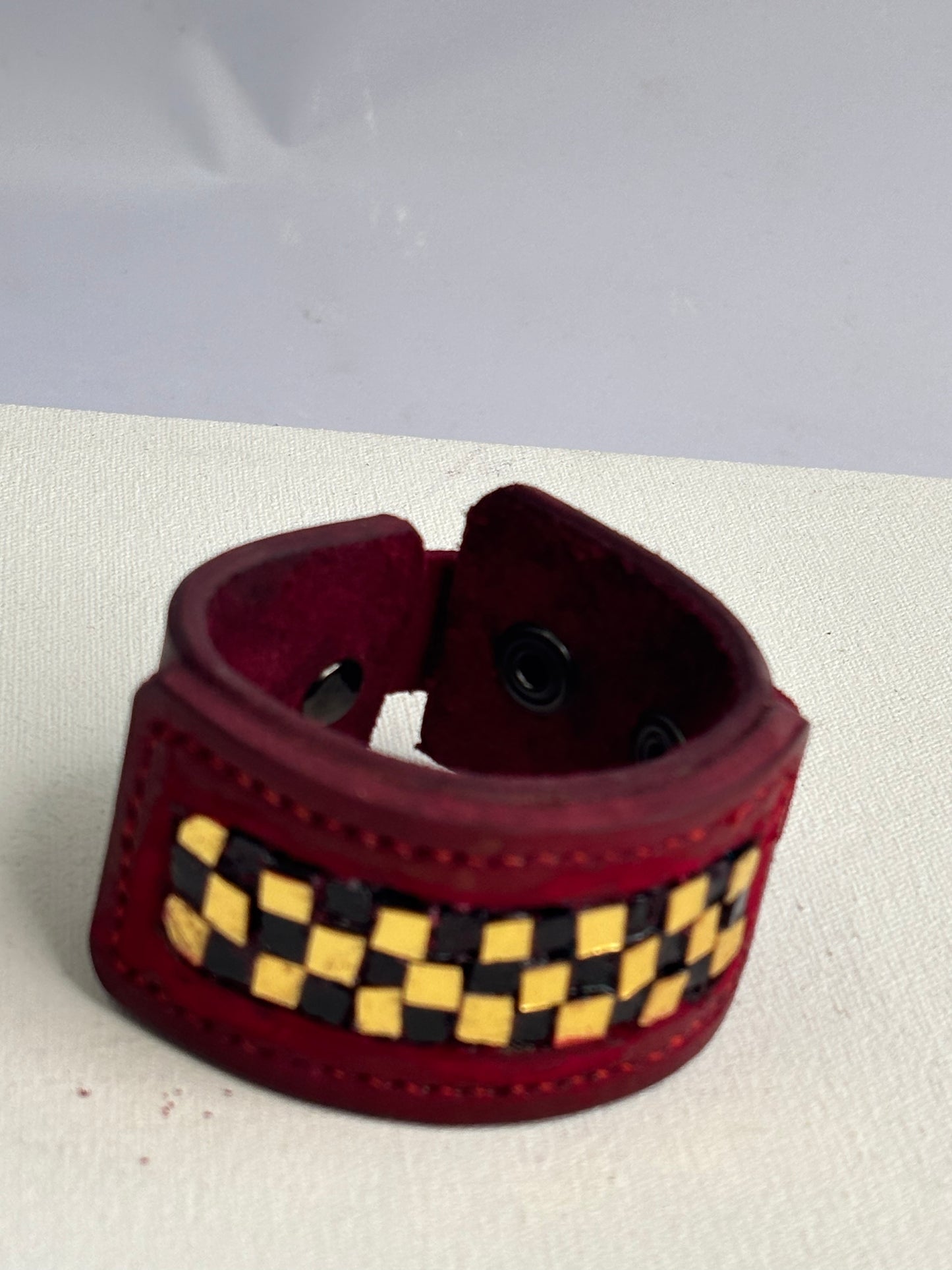 Red leather gold and black glass inlaid leather Cuff