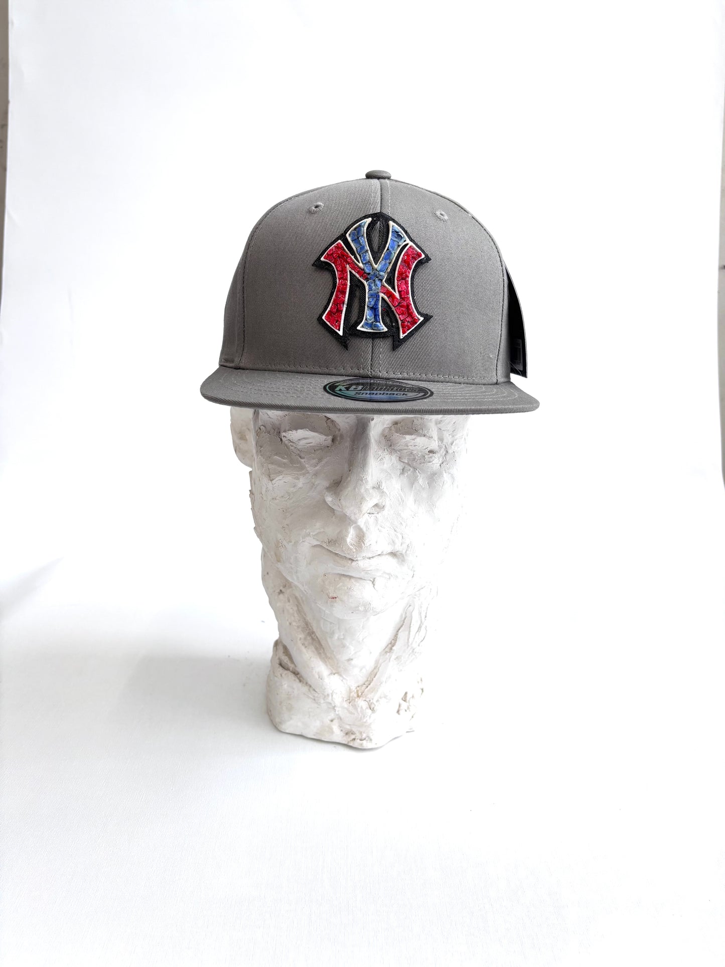 New York Yankees adjustable snapback hat with a handcrafted glass micro mosaic logo. One-size-fits-most. Bold, unique, fan-ready.